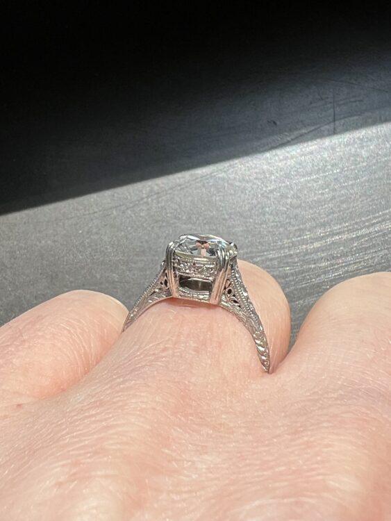 Art Deco Diamond Engagement Ring A close-up shot of someone wearing an Art Deco diamond engagement ring