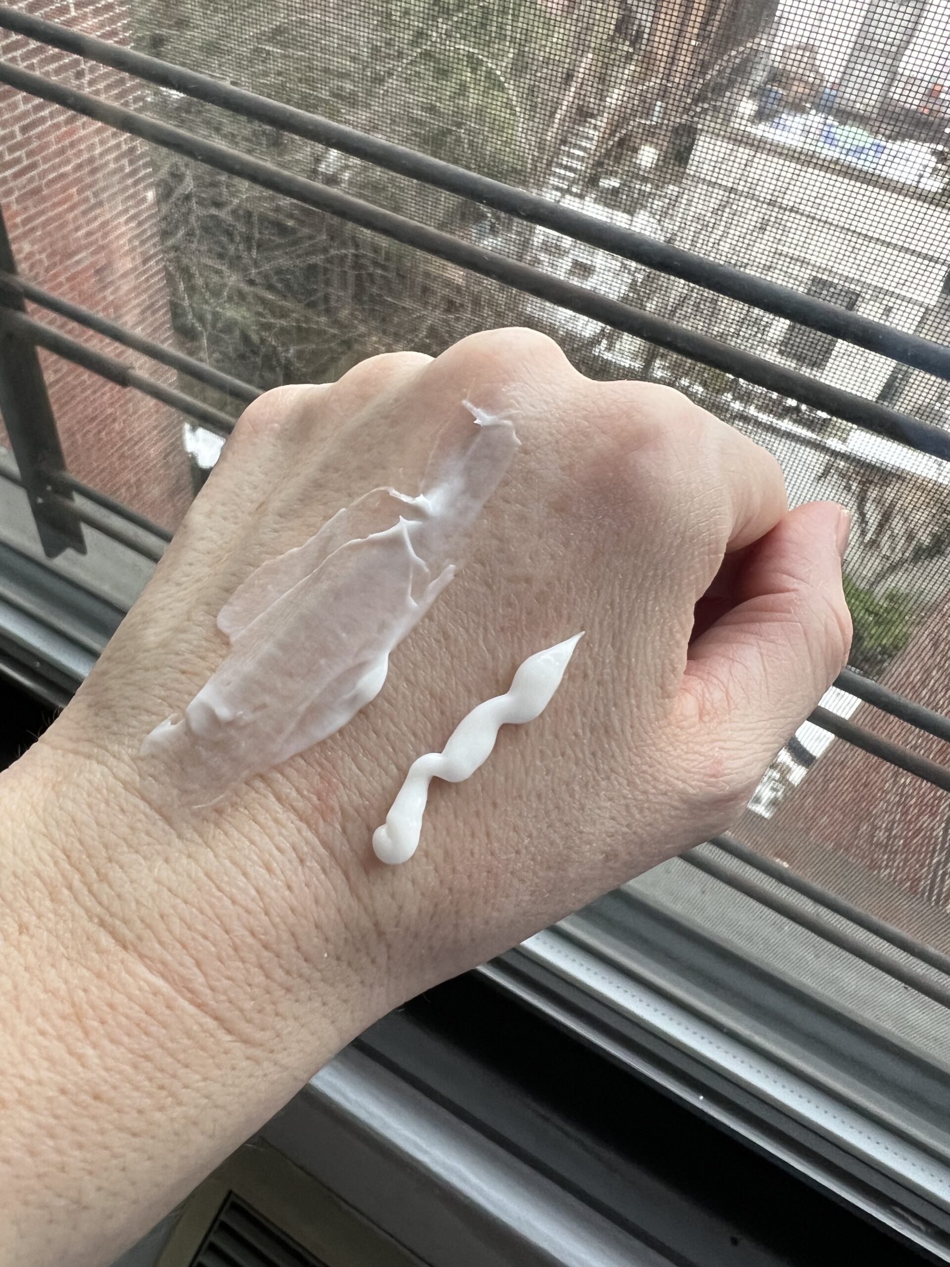 Cream on someone's left hand